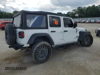 2023 Jeep Wrangler Sport с VIN 1C4HJXDGXPW596127, выставлен на аукционе Copart как лот 56645205 с пробегом 64 257 миль миль и Списание • Salvage title. История ставок и продаж доступна на DreamBid. Изображение 3.