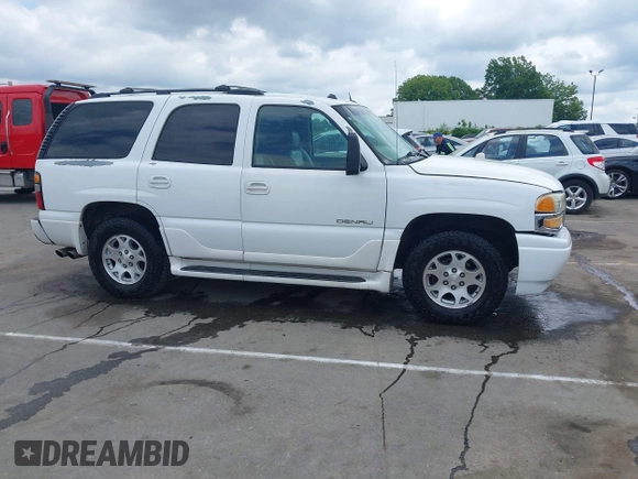 2005 GMC Yukon Denali z VIN 1GKEK63U55J259803, wystawiony jako IAAI lot #42126835 z przebiegiem 199 762 mil mil oraz . Historia ofert i sprzedaży dostępna na DreamBid. Obrazek 13.