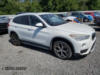 2018 BMW X1 sDrive28i with VIN WBXHU7C32J5L07666, listed as a Copart auction lot 54173465 with 132,514 mi miles and Clean Title. Bid and sale history available at DreamBid. Image 4.