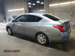 2014 Nissan Versa S Plus with VIN 3N1CN7AP6EL828134, listed as a Copart auction lot 53902045 with 142,825 mi miles and Salvage Title. Bid and sale history available at DreamBid. Image 2.