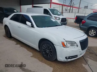 2013 Chrysler 300 with VIN 2C3CCAAG9DH588198, listed as a IAAI auction lot 42556294 with 171,765 mi miles and . Bid and sale history available at DreamBid. Image 1.