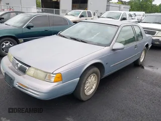 1995 Mercury Cougar z VIN 1MELM62W3SH600097, wystawiony jako IAAI lot #42185484 z przebiegiem 216 393 mil mil oraz . Historia ofert i sprzedaży dostępna na DreamBid. Obrazek 2.