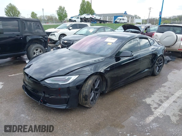 2022 Tesla Model S Plaid with VIN 5YJSA1E60NF460244, listed as a IAAI auction lot 41996403 with Not provided miles and . Bid and sale history available at DreamBid. Image 2.