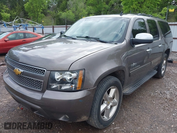 2011 Chevrolet Suburban LT with VIN 1GNSCJE03BR267184, listed as a IAAI auction lot 42156424 with 307,618 mi miles. Bid and sale history available at carsss.com. Image 2.