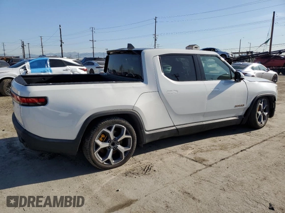 2022 Rivian R1T Adventure z VIN 7FCTGAAA9NN014280, wystawiony jako Copart lot #49723355 z przebiegiem 28 601 mil mil oraz Szkody całkowita. Historia ofert i sprzedaży dostępna na DreamBid. Obrazek 3.