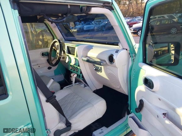 2010 Jeep Wrangler Unlimited Sport with VIN 1J4BA3H15AL166397, listed as a IAAI auction lot 41391376 with 87,091 mi miles. Bid and sale history available at carsss.com. Image 5.