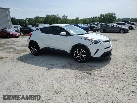 2019 Toyota C-HR XLE z VIN NMTKHMBX5KR079425, wystawiony jako Copart lot #57315345 z przebiegiem 109 441 mil mil oraz Szkoda całkowita • Salvage title. Historia ofert i sprzedaży dostępna na DreamBid. Obrazek 14.