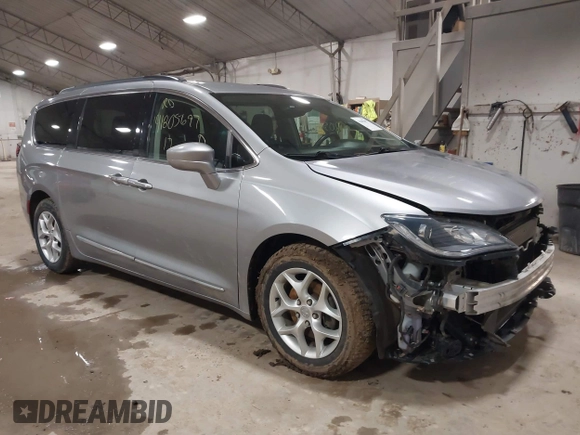 2017 Chrysler Pacifica Touring L with VIN 2C4RC1BG7HR831320, listed as a IAAI auction lot 41805697 with 137,743 mi miles and . Bid and sale history available at DreamBid. Image 1.