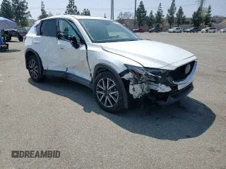 2018 Mazda CX-5 Grand Touring z VIN JM3KFADM3J1464073, wystawiony jako Copart lot #59571385 z przebiegiem Nie podano mil oraz Szkoda całkowita • Salvage title. Historia ofert i sprzedaży dostępna na DreamBid. Obrazek 14.