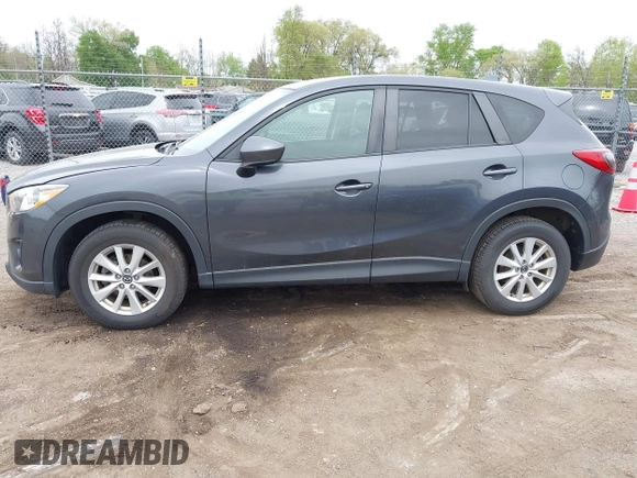 2014 Mazda CX-5 Touring with VIN JM3KE2CYXE0332517, listed as a IAAI auction lot 42109592 with 138,214 mi miles. Bid and sale history available at carsss.com. Image 14.