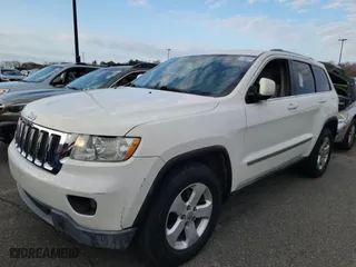2011 Jeep Grand Cherokee Laredo with VIN 1J4RR4GG1BC669834, listed as a Copart auction lot 52923845 with 173,943 mi miles and Clean Title. Bid and sale history available at carsss.com. Image 2.