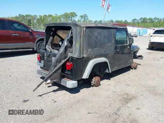 2005 Jeep Wrangler Unlimited with VIN 1J4FA44S25P385421, listed as a IAAI auction lot 42039381 with 1 mi miles. Bid and sale history available at carsss.com. Image 4.