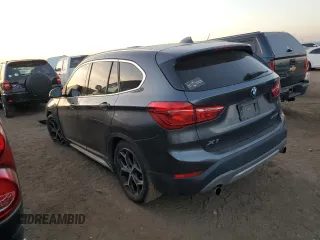 2018 BMW X1 xDrive28i with VIN WBXHT3C38J3H33310, listed as a Copart auction lot 73492324 with 88,620 mi miles and Salvage Title. Bid and sale history available at carsss.com. Image 2.