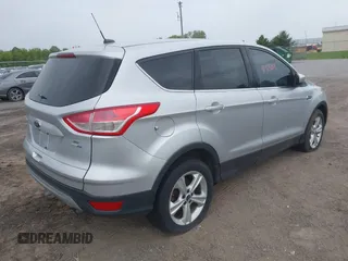 2014 Ford Escape SE z VIN 1FMCU9GX9EUC35713, wystawiony jako IAAI lot #42323161 z przebiegiem 169 393 mil mil oraz . Historia ofert i sprzedaży dostępna na DreamBid. Obrazek 4.