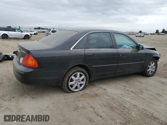 2000 Toyota Avalon XL with VIN 4T1BF28B4YU105732, listed as a Copart auction lot 54752665 with 143,855 mi miles and Salvage Title. Bid and sale history available at DreamBid. Image 3.