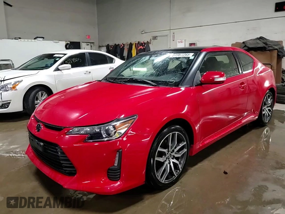 2014 Scion tC z VIN JTKJF5C71E3072025, wystawiony jako Copart lot #51967285 z przebiegiem 187 091 mil mil oraz Szkody całkowita. Historia ofert i sprzedaży dostępna na DreamBid. Obrazek 14.