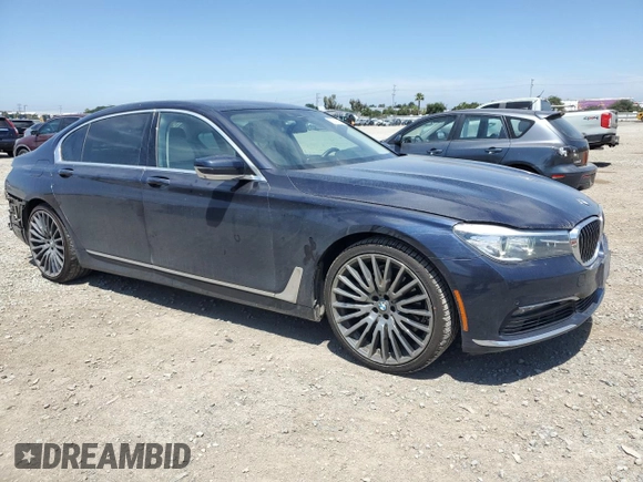 2018 BMW 7 Series 740i with VIN WBA7E2C58JG743126, listed as a Copart auction lot 53843795 with 90,614 mi miles and Salvage title. Bid and sale history available at DreamBid. Image 4.