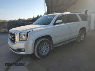 2015 GMC Yukon SLT with VIN 1GKS1BKCXFR563509, listed as a Copart auction lot 77188854 with 127,481 mi miles and Clean Title. Bid and sale history available at carsss.com. Image 1.