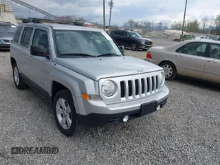 2014 Jeep Patriot Sport with VIN 1C4NJRBB4ED510759, listed as a IAAI auction lot 42000853 with 128,105 mi miles. Bid and sale history available at carsss.com. Image 1.