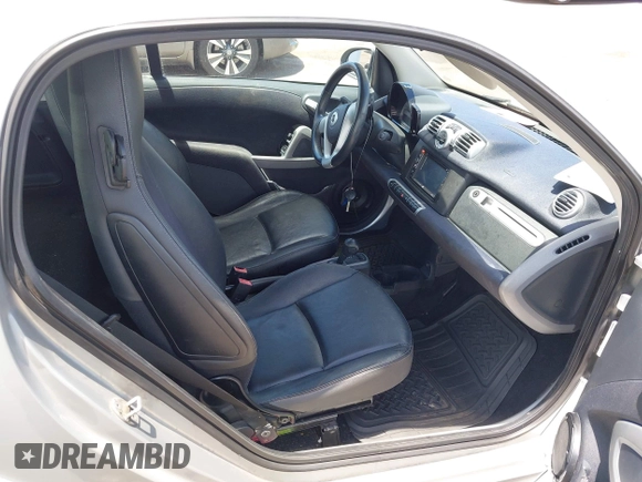 2013 Smart fortwo Pure with VIN WMEEJ3BA8DK605597, listed as a IAAI auction lot 42395754 with 55,637 mi miles and . Bid and sale history available at DreamBid. Image 5.
