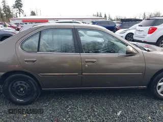 1999 Nissan Altima XE with VIN 1N4DL01D1XC210017, listed as a IAAI auction lot 41199544 with 297,917 mi miles. Bid and sale history available at carsss.com. Image 13.