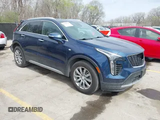 2021 Cadillac XT4 AWD Premium Luxury z VIN 1GYFZDR45MF048569, wystawiony jako IAAI lot #41902941 z przebiegiem 53 891 mil mil oraz . Historia ofert i sprzedaży dostępna na DreamBid. Obrazek 1.