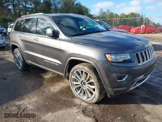 2014 Jeep Grand Cherokee Overland with VIN 1C4RJFCT8EC183165, listed as a IAAI auction lot 41298114 with 114,187 mi miles. Bid and sale history available at carsss.com. Image 1.