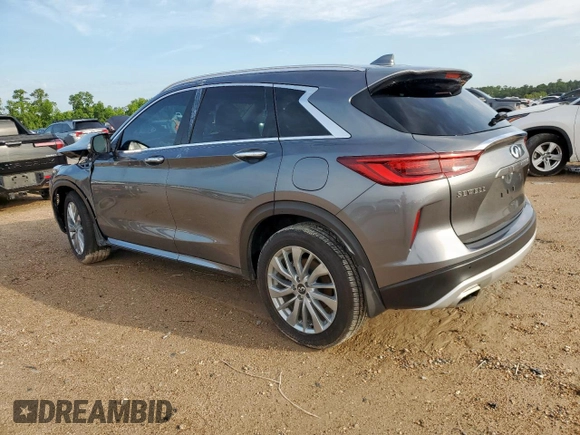 2023 Infiniti QX50 Luxe z VIN 3PCAJ5BA3PF105275, wystawiony jako Copart lot #61144205 z przebiegiem 26 399 mil mil oraz Szkoda całkowita • Salvage title. Historia ofert i sprzedaży dostępna na DreamBid. Obrazek 2.