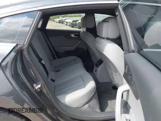 2018 Audi A5 Sportback Premium z VIN WAUANCF5XJA022221, wystawiony jako IAAI lot #42041410 z przebiegiem 94 851 mil mil oraz . Historia ofert i sprzedaży dostępna na DreamBid. Obrazek 8.