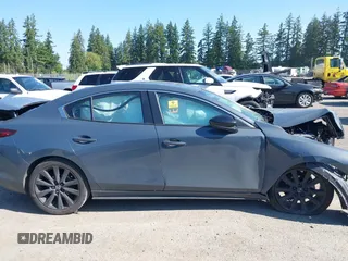 2023 Mazda 3 S Carbon Edition with VIN 3MZBPACM5PM376545, listed as a IAAI auction lot 42404054 with Not provided miles and . Bid and sale history available at DreamBid. Image 13.