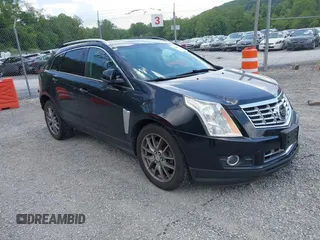 2014 Cadillac SRX Performance Collection with VIN 3GYFNFE30ES612131, listed as a IAAI auction lot 42435651 with 141,711 mi miles and . Bid and sale history available at DreamBid. Image 1.
