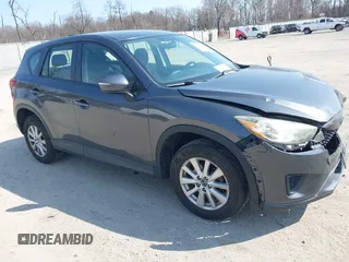 2015 Mazda CX-5 Sport z VIN JM3KE2BE7F0522073, wystawiony jako IAAI lot #41791803 z przebiegiem 120 933 mil mil oraz . Historia ofert i sprzedaży dostępna na DreamBid. Obrazek 1.