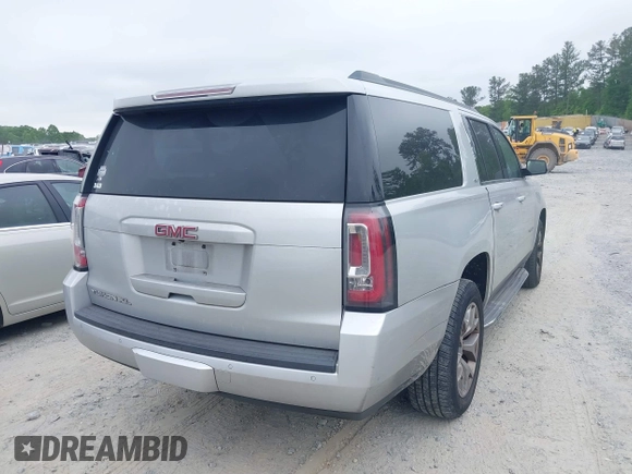 2015 GMC Yukon XL SLT with VIN 1GKS1HKC2FR251672, listed as a IAAI auction lot 42152312 with 232,736 mi miles and . Bid and sale history available at carsss.com. Image 4.