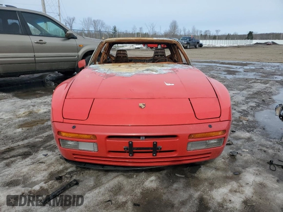 1986 Porsche 944 z VIN WP0AA0958GN152718, wystawiony jako Copart lot #49056775 z przebiegiem Nie podano mil oraz Szkoda całkowita • Salvage title. Historia ofert i sprzedaży dostępna na DreamBid. Obrazek 5.
