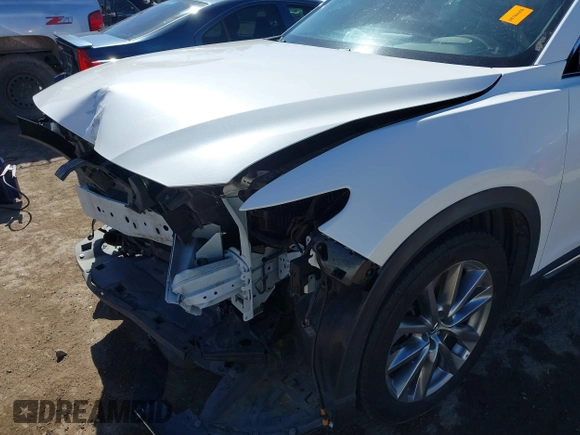 2018 Mazda CX-9 Grand Touring with VIN JM3TCADY6J0229768, listed as a IAAI auction lot 41724072 with 80,918 mi miles and . Bid and sale history available at DreamBid. Image 6.