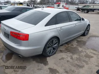 2015 Audi A6 Premium Plus z VIN WAUGFAFC8FN032627, wystawiony jako IAAI lot #41270302 z przebiegiem 82 104 mil mil oraz . Historia ofert i sprzedaży dostępna na DreamBid. Obrazek 4.