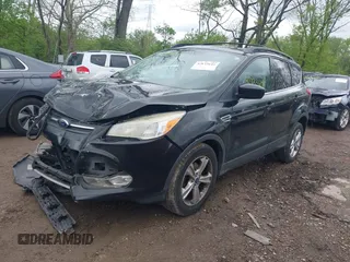 2013 Ford Escape SE with VIN 1FMCU0GX6DUC98598, listed as a IAAI auction lot 42133641 with 174,111 mi miles and . Bid and sale history available at DreamBid. Image 2.