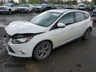 2013 Ford Focus SE with VIN 1FADP3K20DL118007, listed as a Copart auction lot 52184605 with 153,033 mi miles and Salvage Title. Bid and sale history available at DreamBid. Image 1.
