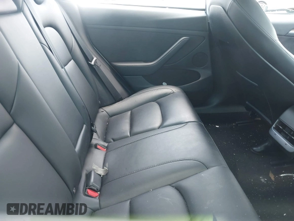 2023 Tesla Model 3 with VIN 5YJ3E1EA5PF407054, listed as a IAAI auction lot 42313770 with 57,621 mi miles and . Bid and sale history available at DreamBid. Image 8.