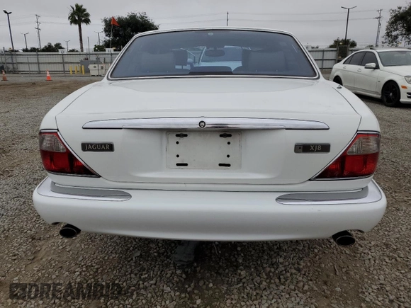 1999 Jaguar XJ with VIN SAJHX1040XC864208, listed as a Copart auction lot 59748585 with 130,577 mi miles and Clean title. Bid and sale history available at DreamBid. Image 6.