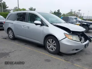 2014 Honda Odyssey EX-L z VIN 5FNRL5H67EB085982, wystawiony jako IAAI lot #42173478 z przebiegiem 114 144 mil mil oraz . Historia ofert i sprzedaży dostępna na DreamBid. Obrazek 1.