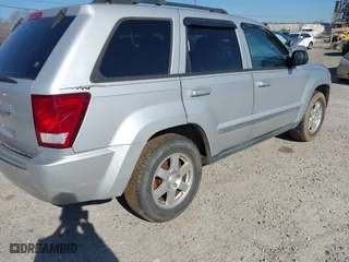 2010 Jeep Grand Cherokee Laredo with VIN 1J4PS4GKXAC103153, listed as a IAAI auction lot 41760743 with 185,138 mi miles. Bid and sale history available at carsss.com. Image 4.