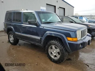 2010 Jeep Commander Sport with VIN 1J4RG4GK5AC119433, listed as a Copart auction lot 87657265 with 212,973 mi miles and Salvage title. Bid and sale history available at DreamBid. Image 4.
