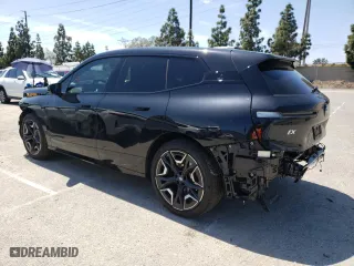 2024 BMW iX xDrive50 with VIN WB523CF05RCN96948, listed as a Copart auction lot 50858304 with 8,923 mi miles and Salvage Title. Bid and sale history available at carsss.com. Image 2.