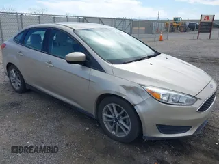 2018 Ford Focus SE with VIN 1FADP3FE7JL230870, listed as a IAAI auction lot 42021541 with 84,000 mi miles. Bid and sale history available at carsss.com. Image 1.