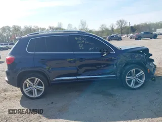 2014 Volkswagen Tiguan S z VIN WVGBV3AX7EW545538, wystawiony jako IAAI lot #42083281 z przebiegiem 129 227 mil mil oraz . Historia ofert i sprzedaży dostępna na DreamBid. Obrazek 13.