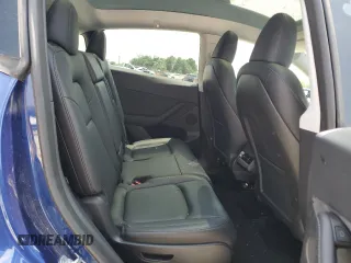 2024 Tesla Model Y Long Range with VIN 7SAYGAEE6RF196245, listed as a Copart auction lot 54667765 with 10,336 mi miles and Salvage title. Bid and sale history available at DreamBid. Image 11.
