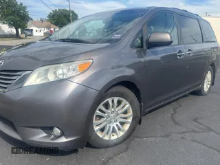 2015 Toyota Sienna XLE with VIN 5TDYK3DC5FS567460, listed as a Copart auction lot 63311295 with 296,433 mi miles and Clean title. Bid and sale history available at DreamBid. Image 2.