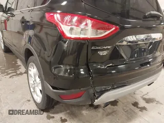 2014 Ford Escape Titanium with VIN 1FMCU9J95EUD85537, listed as a IAAI auction lot 41472236 with 154,796 mi miles. Bid and sale history available at carsss.com. Image 6.