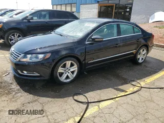 2015 Volkswagen CC Sport z VIN WVWBP7AN8FE804114, wystawiony jako Copart lot #54880245 z przebiegiem 124 639 mil mil oraz Tytuł czysty. Historia ofert i sprzedaży dostępna na DreamBid. Obrazek 1.
